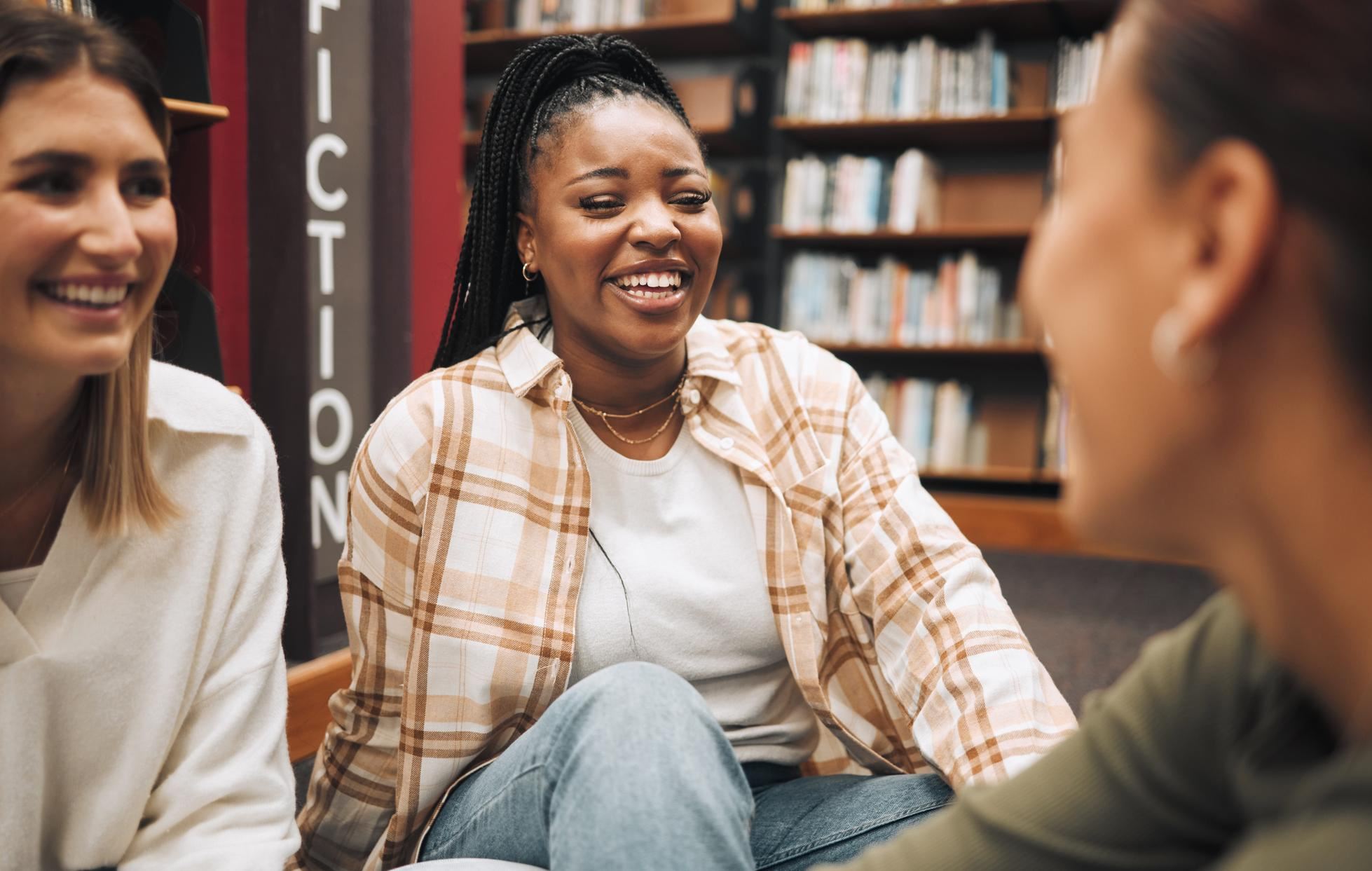 A group of young adults attend a literature reading and discussion group at a local library. 