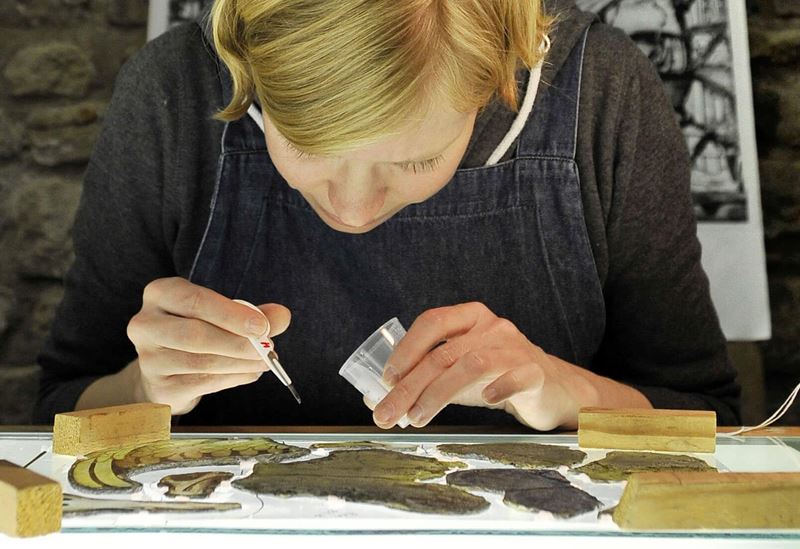 Conservator Danja Kielmann Works A Piece Of Medieval Glass